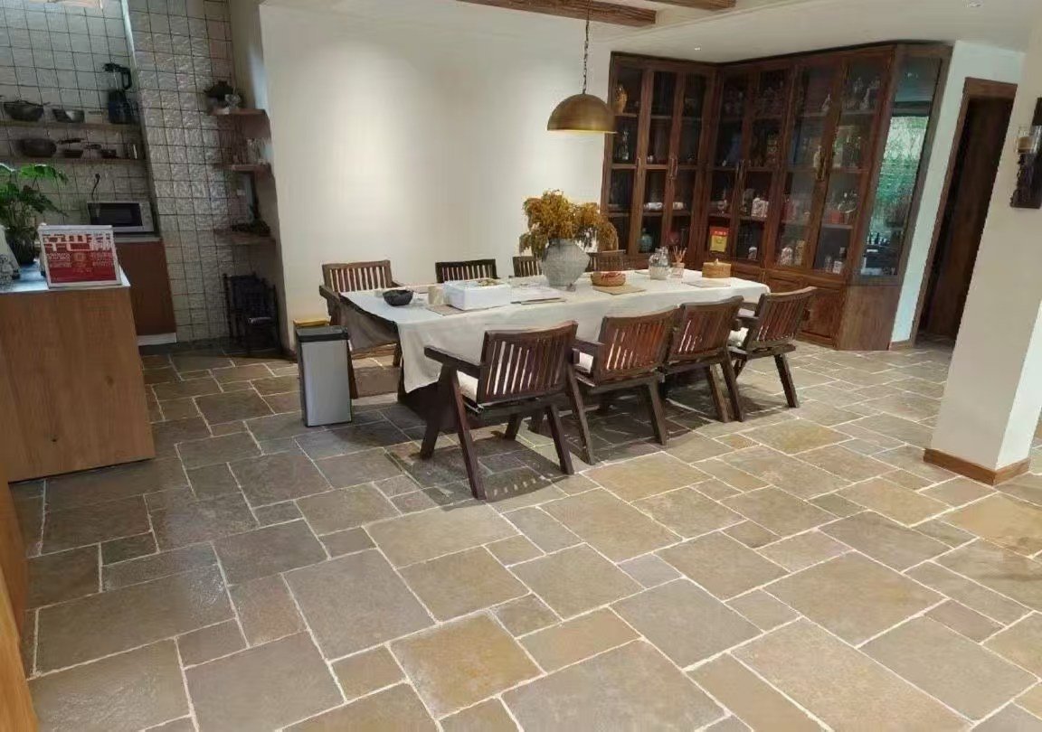 Crazy paving flagstone patio and alfresco room, random pattern anchoring outdoor dining and lounge zones