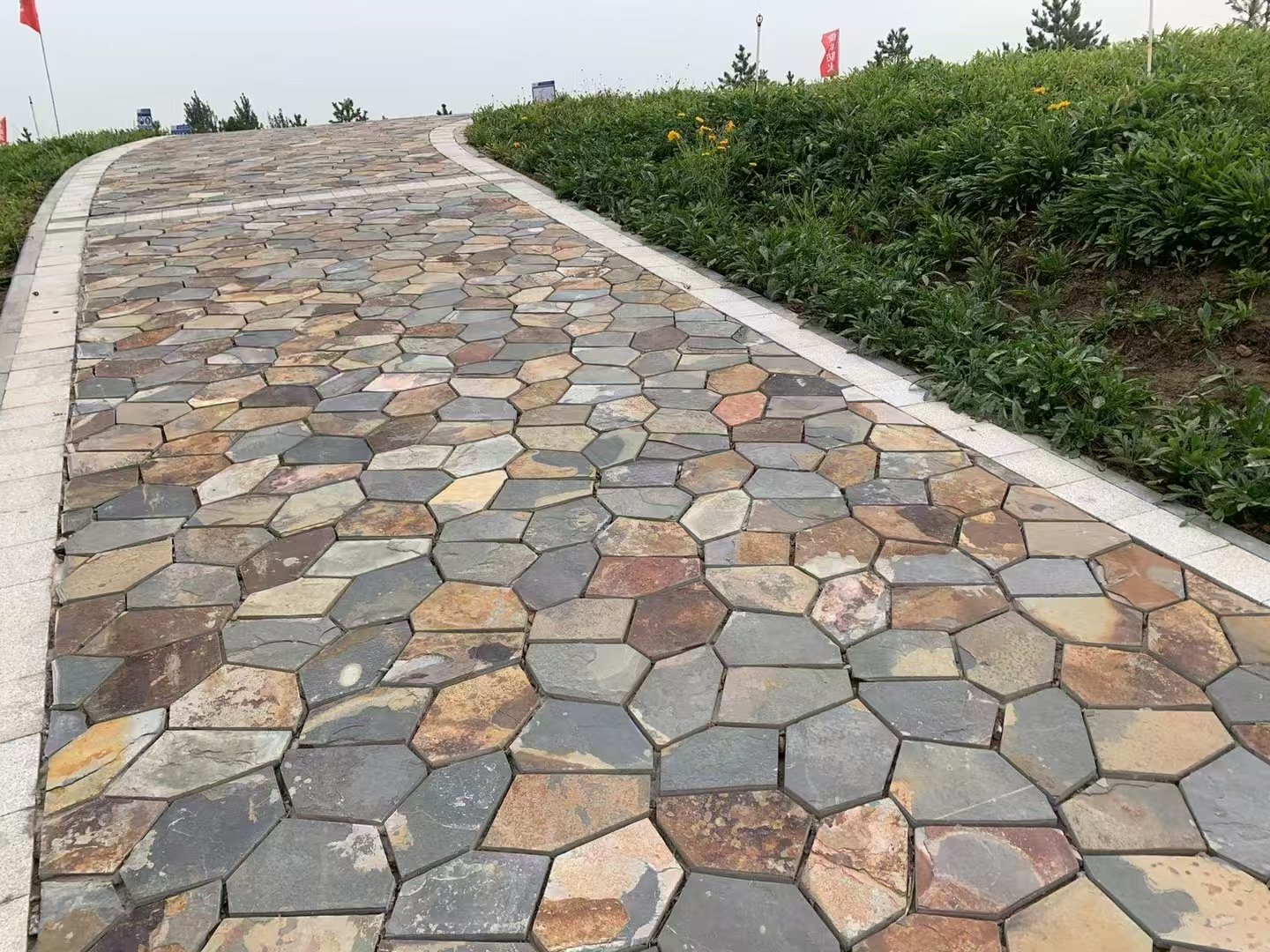 Crazy paving flagstone on a private driveway, thickened vehicular-grade slate over engineered base