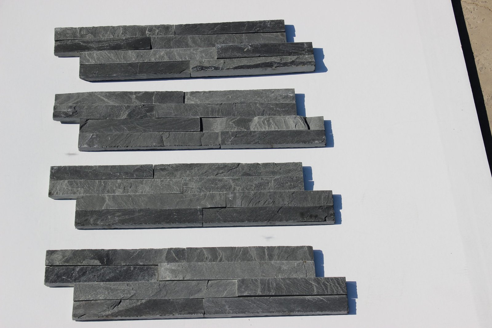 black natural stone thin ledgestone wall cladding 10x36cm details - black stone panels with light mortar joints