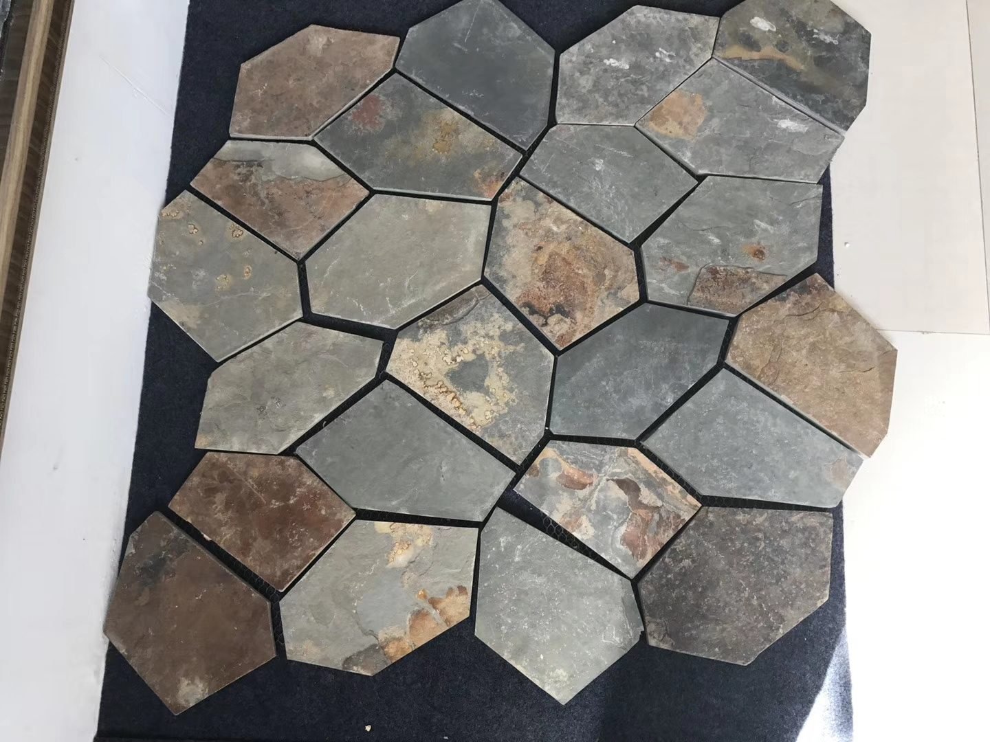 Crazy paving flagstone detail, riven split face texture and mesh bond close-up