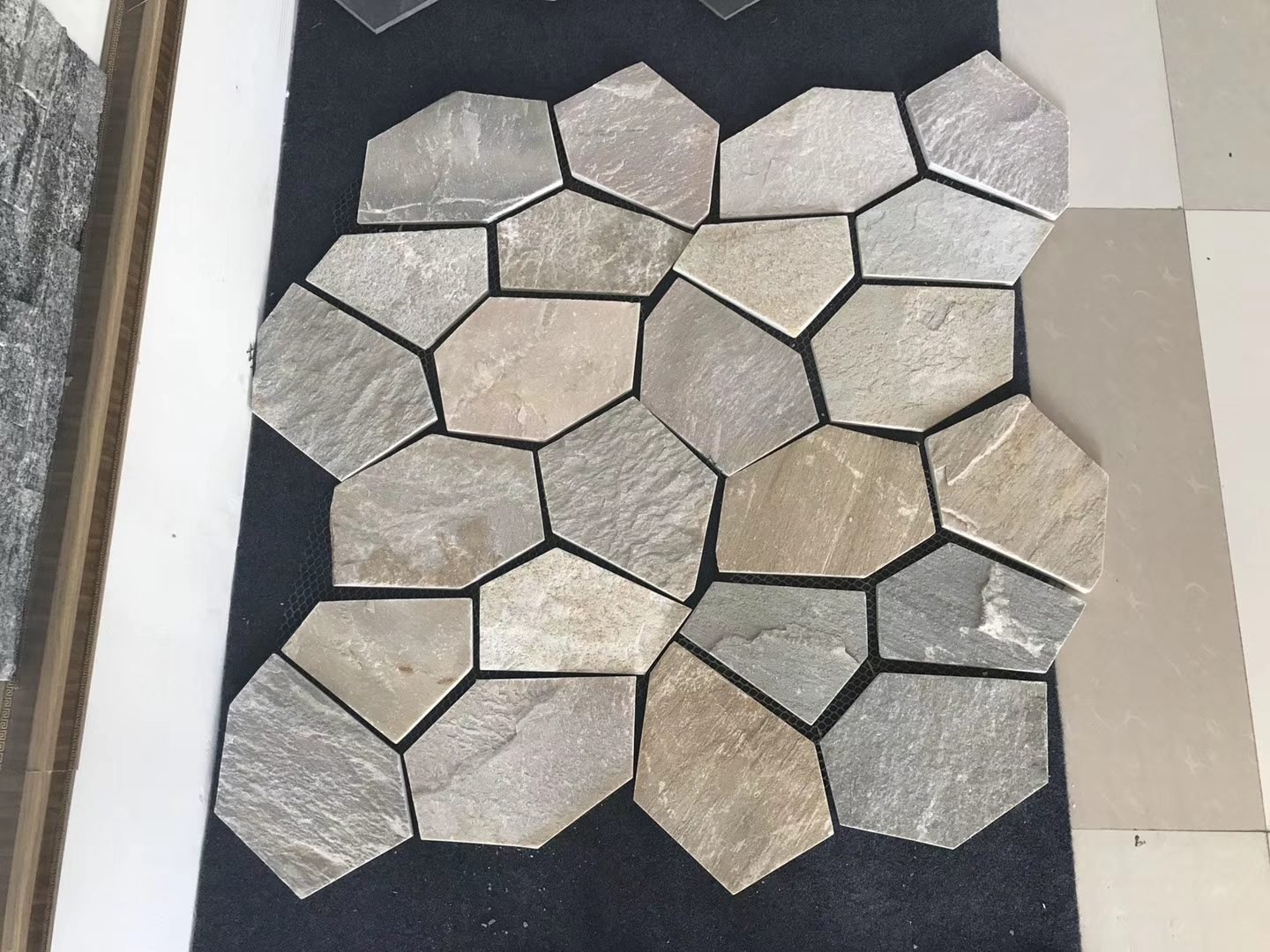 Crazy paving flagstone detail, riven split face texture and mesh bond close-up