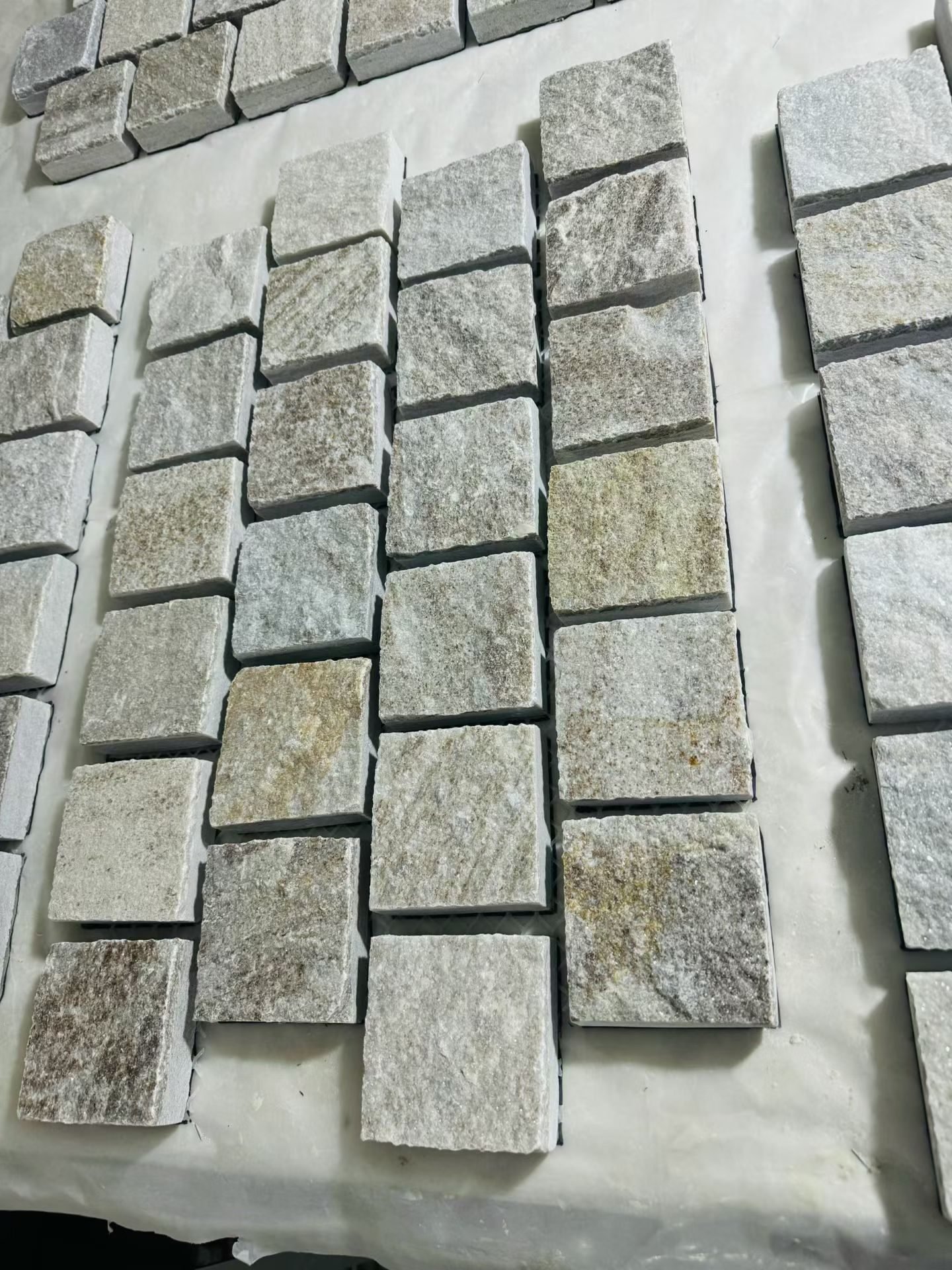 Crazy paving flagstone detail close-up, riven split face and mesh bond quality