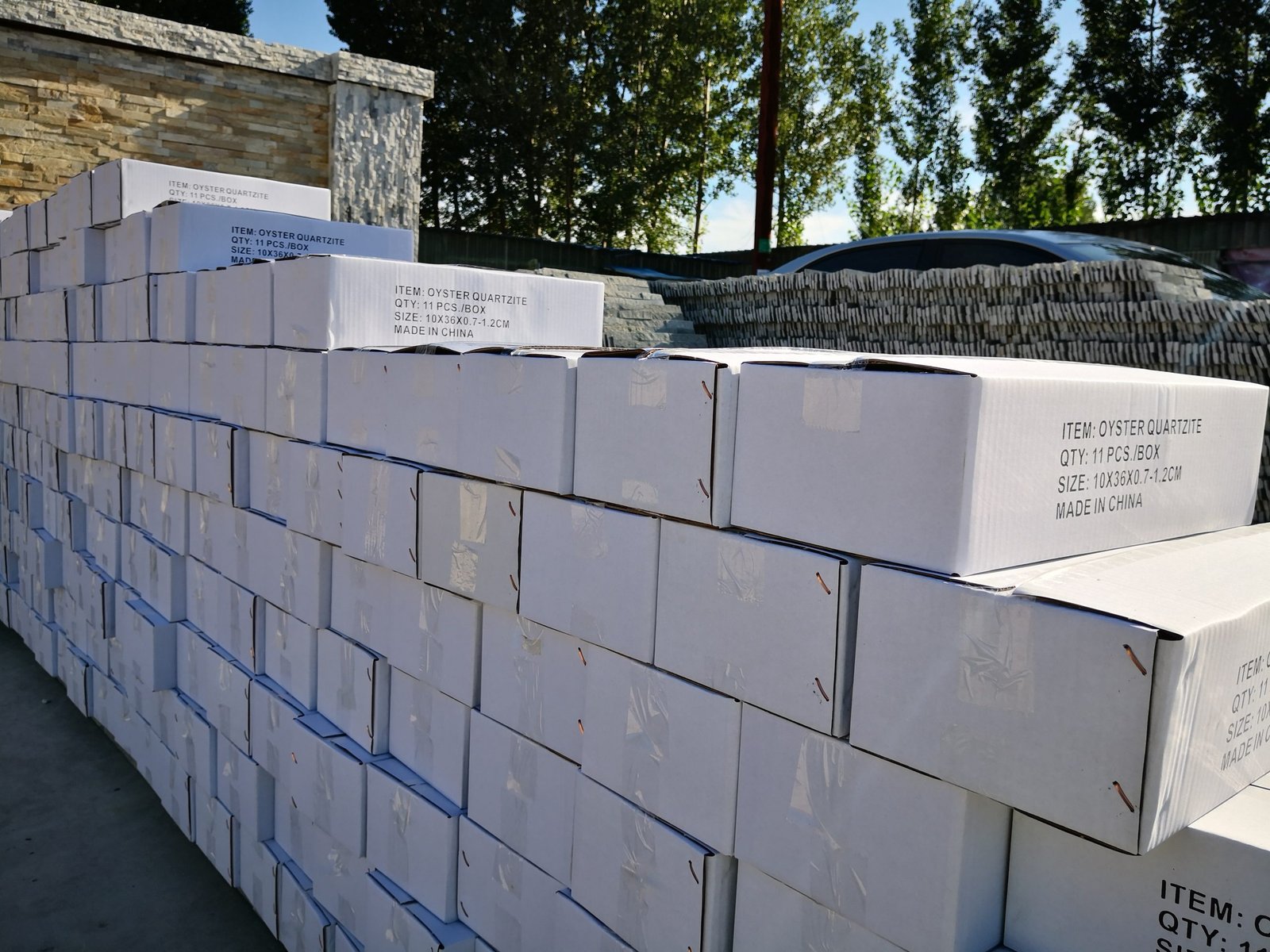 Steel strapping applied to palletized stone cartons