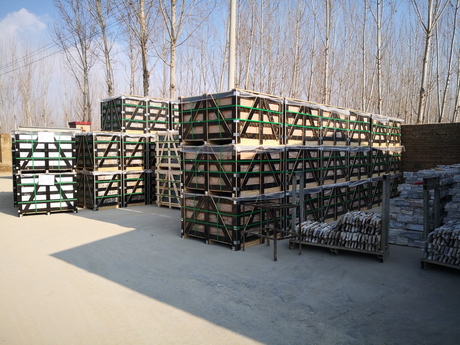 Strapped wooden crates of cement backed panels ready for ocean freight