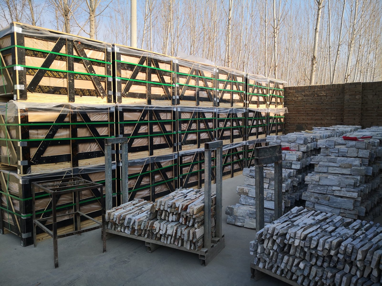 export packed natural stone panel crates staged for phased container loading at Top Stone Panels warehouse facility