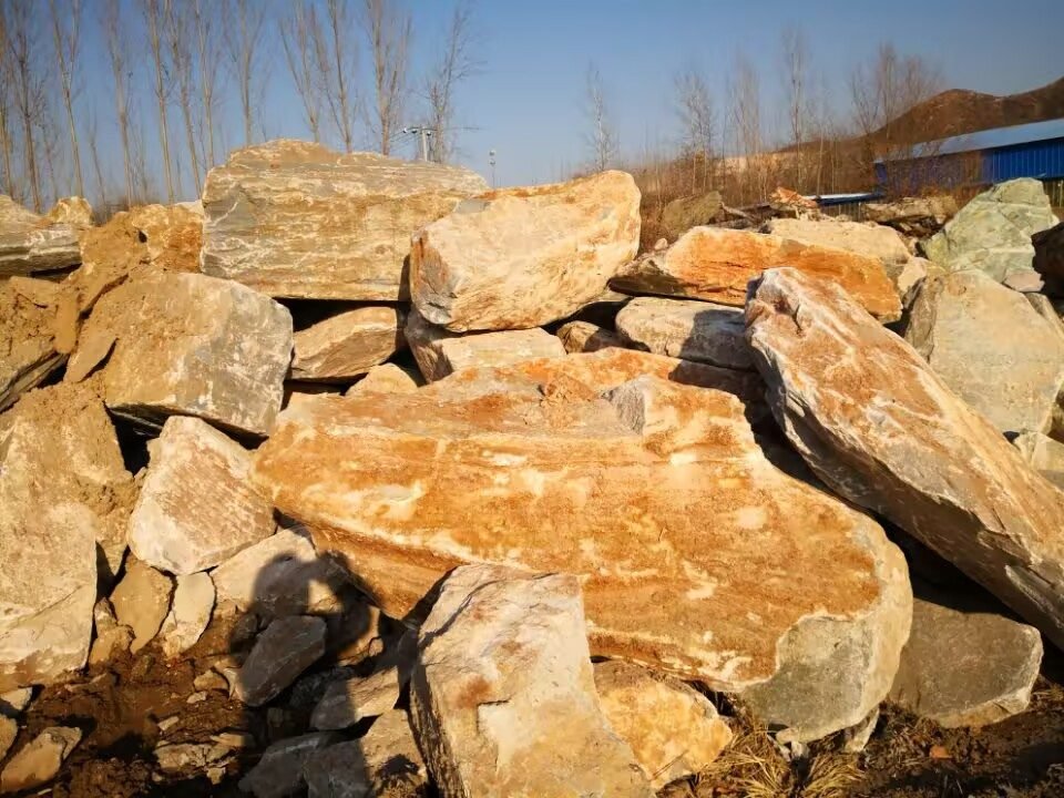 Large beige quartzite rough stone blocks selected at the quarry
