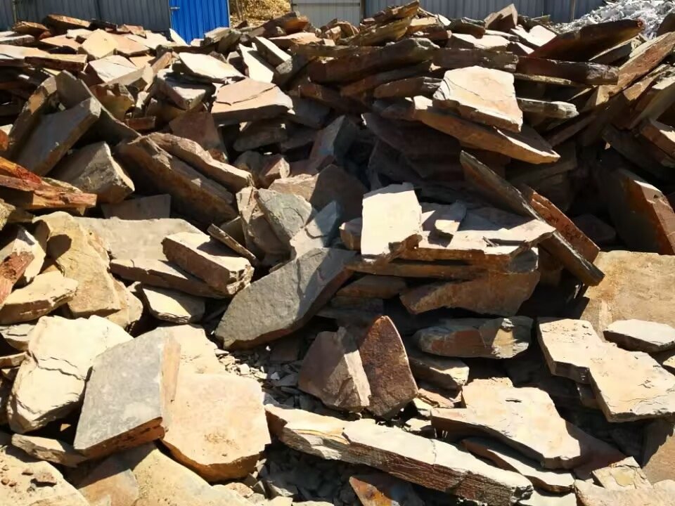 stone quarry visit - quartzite rough blocks staged at the quarry yard, part of the traceability chain buyers check on-site