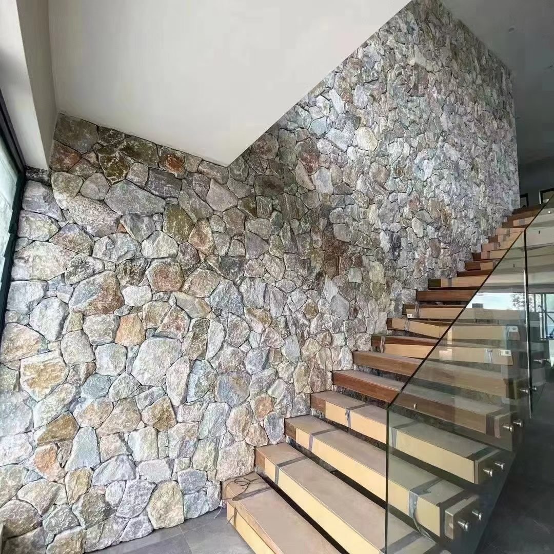 coastal stone facade - natural stone cladding on a sheltered courtyard feature wall in a salt air coastal house