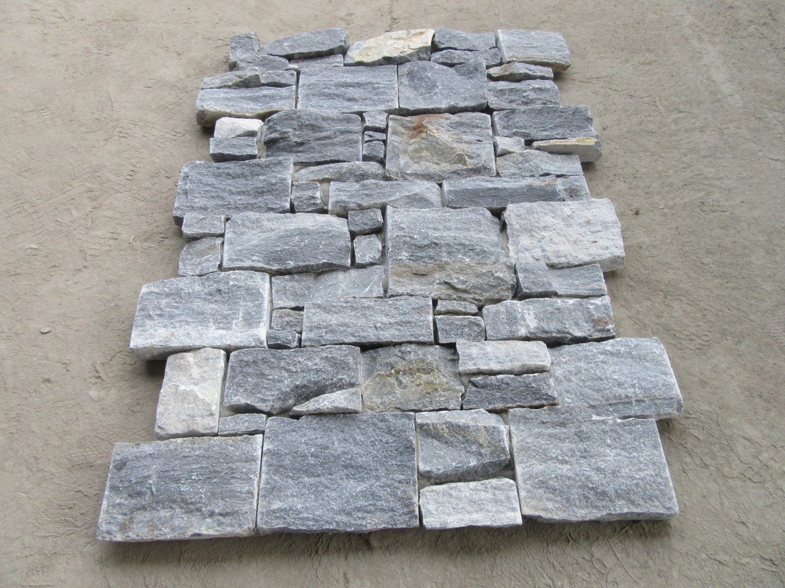 natural stone panel system interlocking detail - stone veneer panels ready for dry-stack retaining wall layout