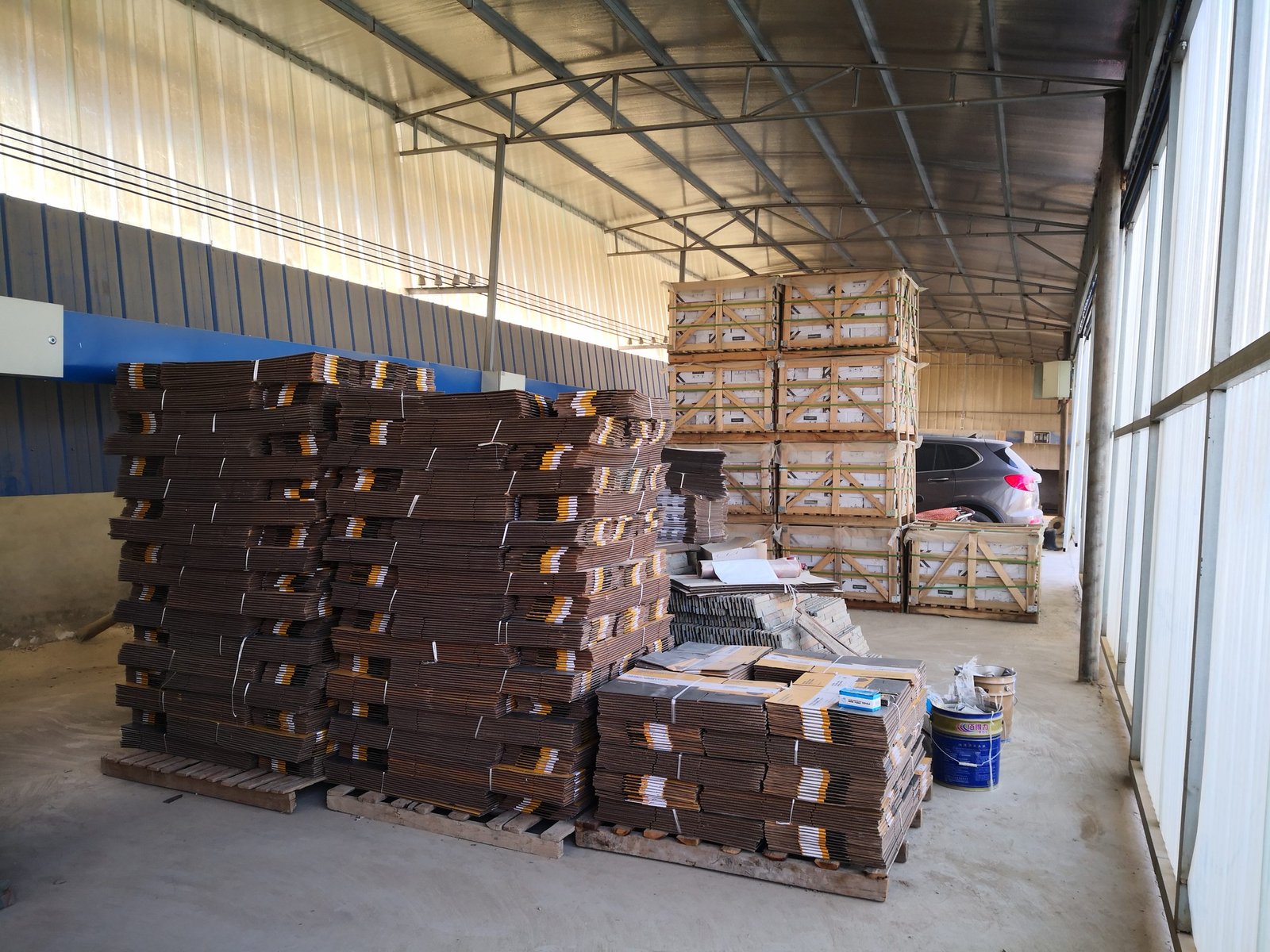 Export warehouse with palletized stone cladding staged for loading