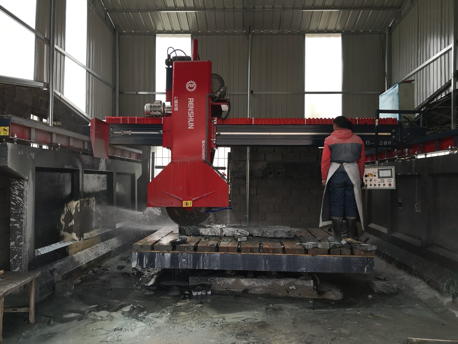 stone window sills surrounds - precision infrared stone cutting machine at the Top Stone Panels factory cutting natural stone trim pieces