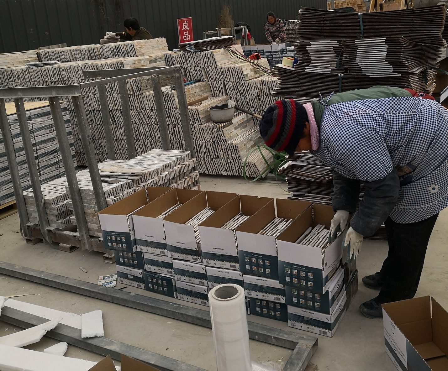Quality control and packing of stacked stone veneer into export cartons