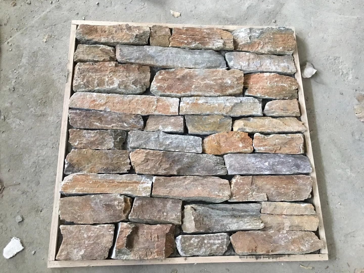 brown stone veneer panels where to use - rusty quartzite linear ashlar thin ledgestone warm tone cladding for exterior facade and fireplace surround