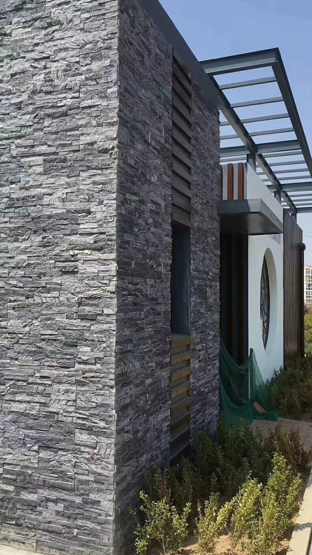 Natural stacked stone fireplace surround in a residential interior