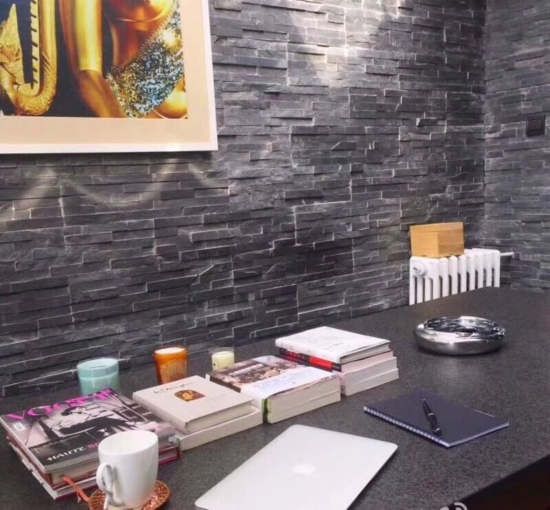 split face wall tiles application - bonded stone veneer panels with clean joints around wall penetrations