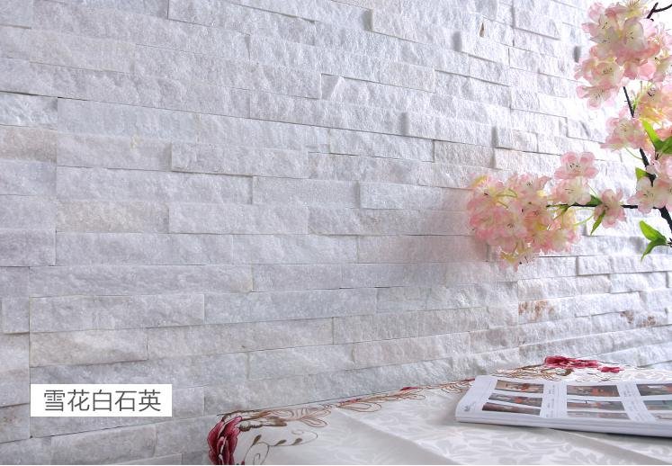 Interior fireplace feature wall clad in natural stacked stone ledger panels with clean faces
