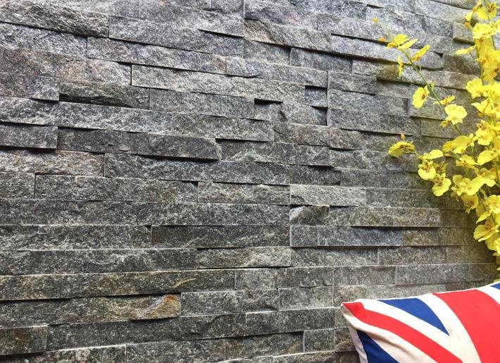 Villa exterior elevation clad in 15x60cm stacked stone ledger panels with pre-made L-corners