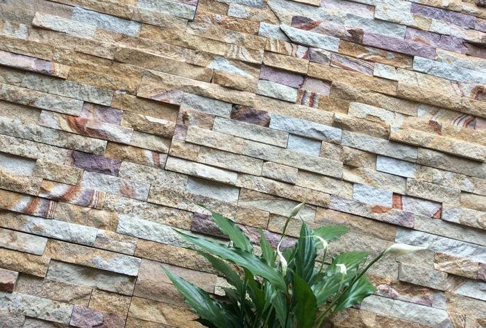 stone veneer caps coping - natural stone cladding application scene on an exterior wall, showing the finished top course ready for coping