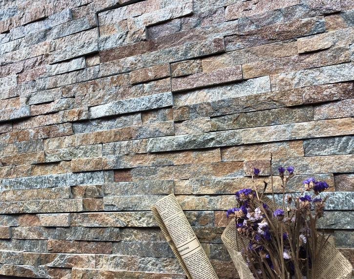 stacked stone application - natural stone cladding installed on a landscape retaining wall surface