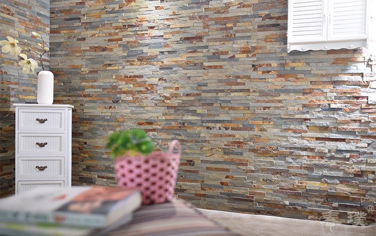 full-wrap stacked stone application - natural slate stacked stone panels applied on an interior feature wall, showing the masonry wrap effect used for kitchen island bases