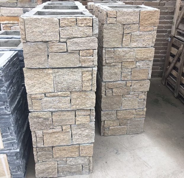 Pre-assembled stone column sections stacked over structural core