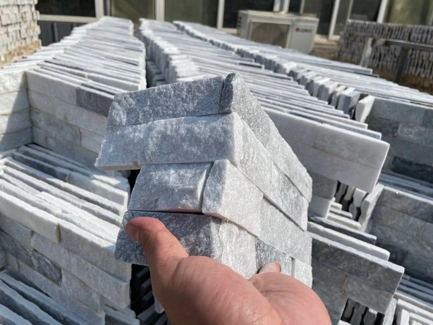 pre-made stacked stone L-corner piece for clean 90 degree turns in ashlar and linear layouts