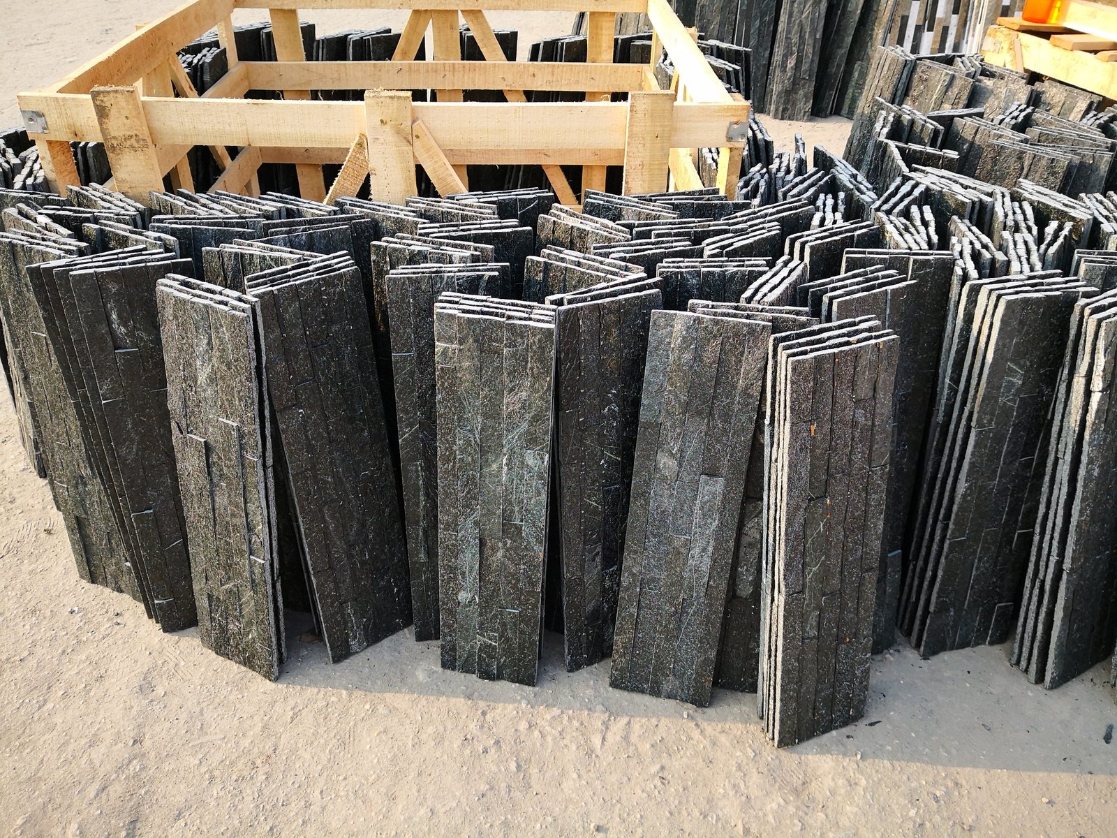 close-up texture detail of stacked stone panels showing natural split face surface for interior walls