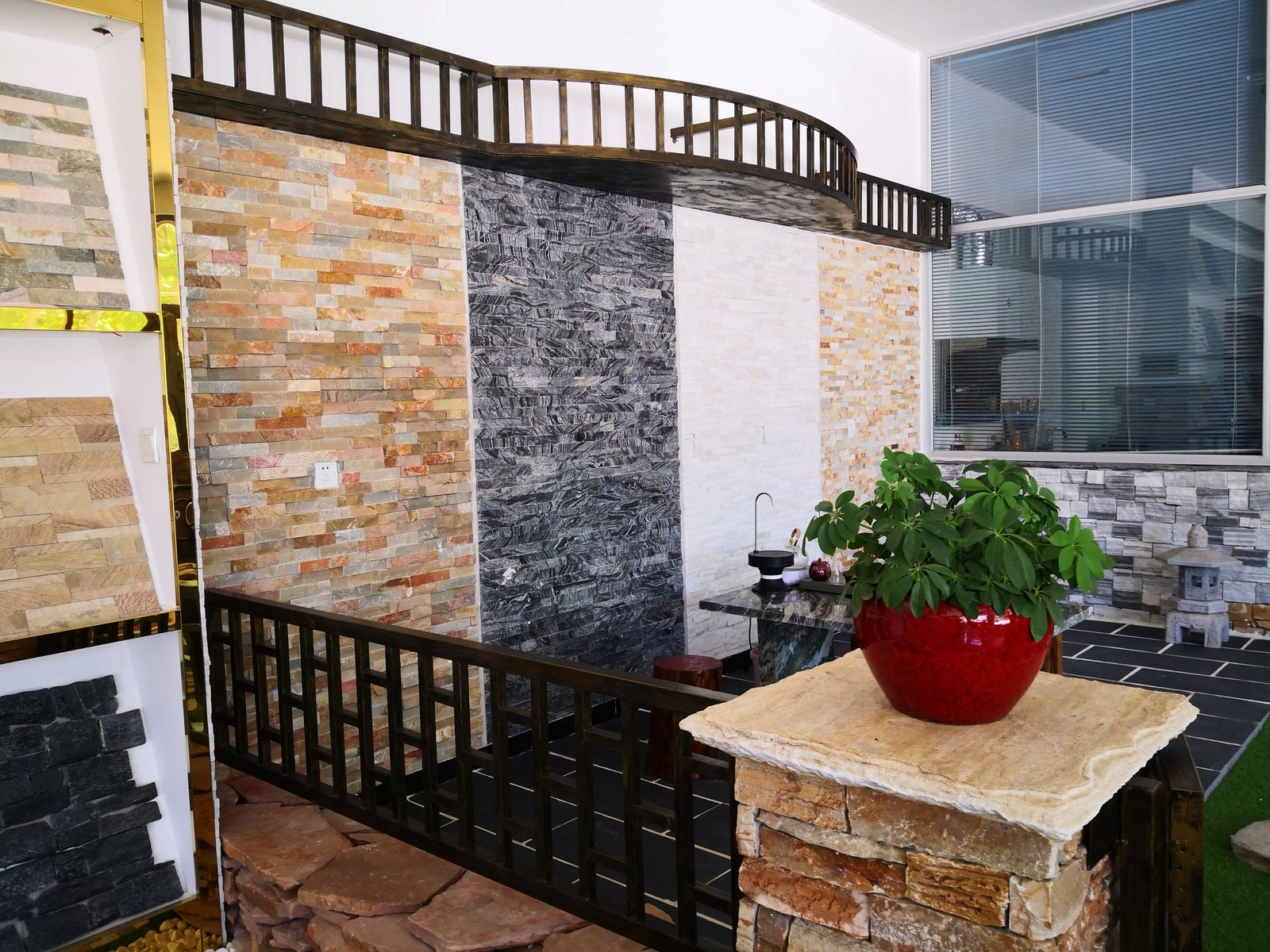 Stacked stone ledger panel samples displayed in the Top Stone Panels factory showroom for OEM approval