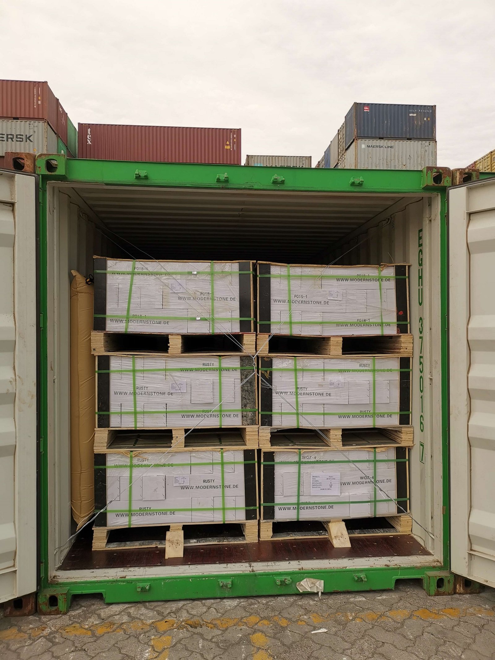 Stacked stone panels packed in plywood pallets ready for container shipping from Tianjin Xingang