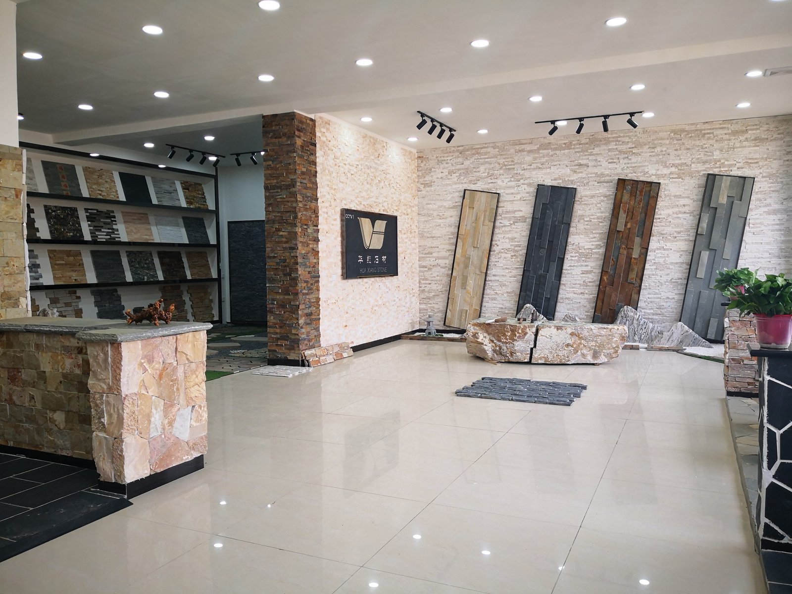 Top Stone Panels factory showroom displaying stacked stone panels and full product sample library