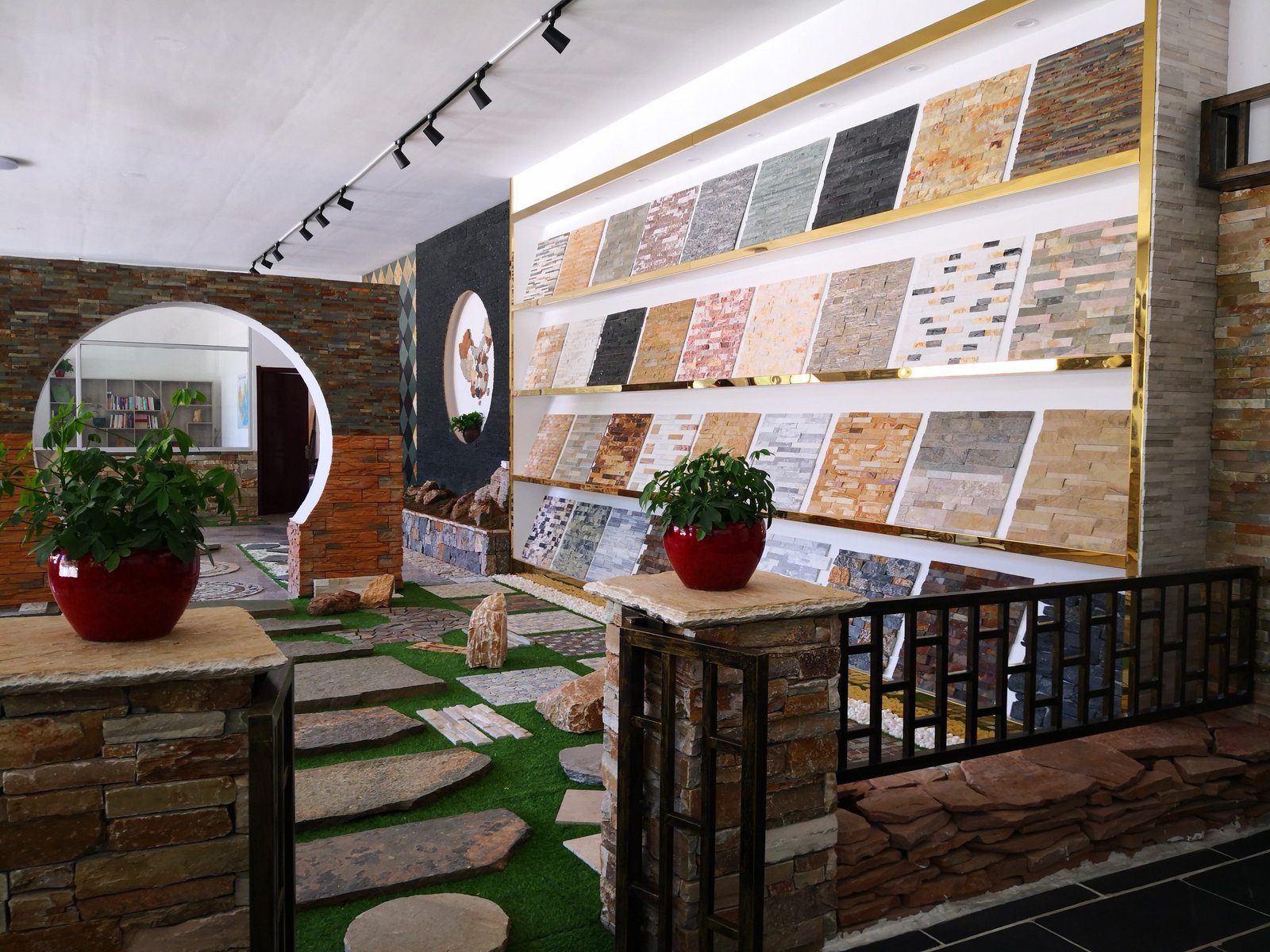 Top Stone Panels factory showroom displaying stacked stone column kits and modular pillar elements