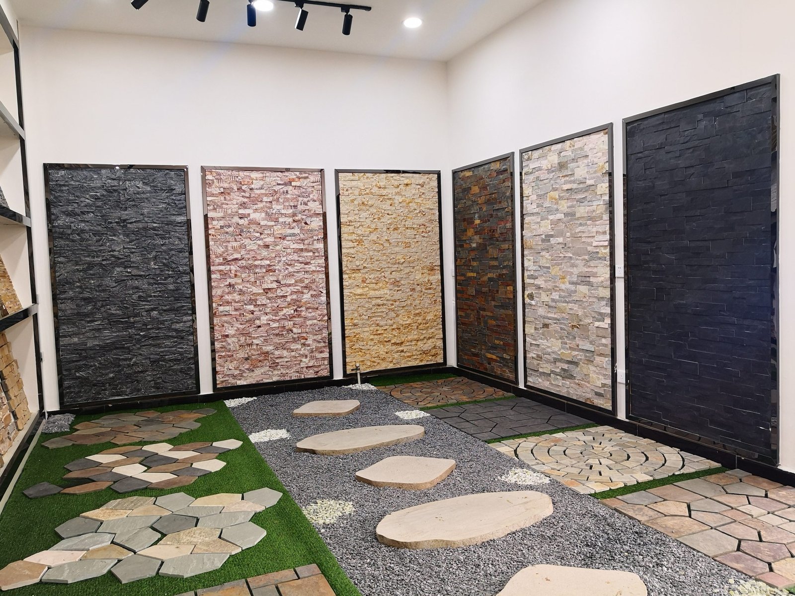 stone cladding wall display showing texture detail under warm LED lighting at Top Stone Panels showroom