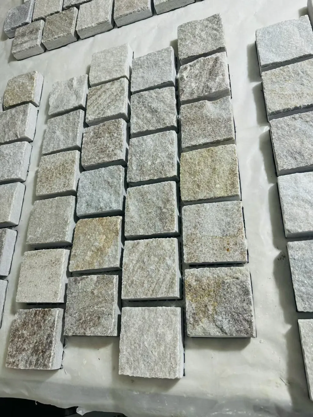 Crazy paving flagstone detail close-up, riven split face and mesh bond quality