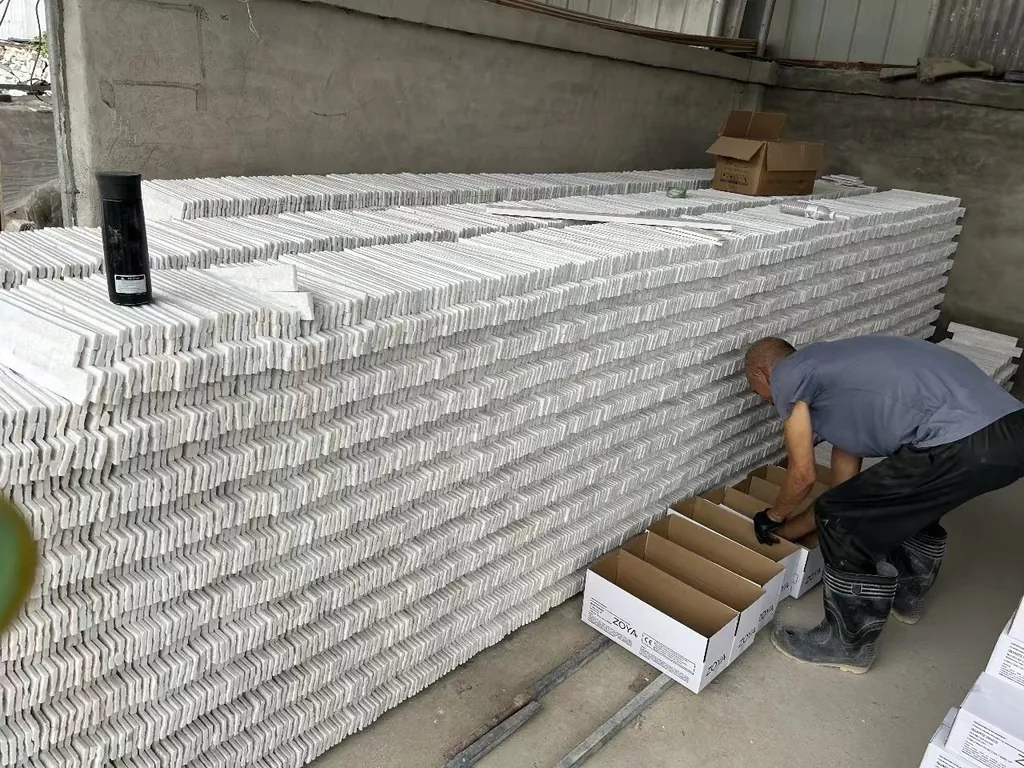 factory worker packing white quartz mini ledgestone